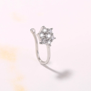 Elegant silver U-shaped non-pierced nose ring featuring a crystal flower design