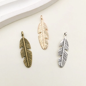 Vintage alloy feather wing charms for DIY jewelry in bronze, gold and silver finish