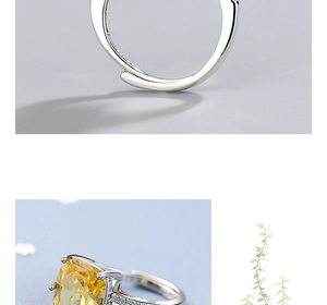 Detail view of S925 hallmark on silver ring with pear-cut yellow gemstone