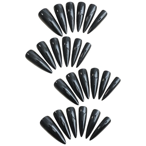 Glossy black long pointed stiletto false nails in various sizes on white background