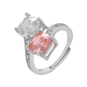 Detail of silver open ring featuring square white and pink zircon stones in a micro-pave setting