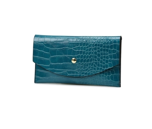 Detail of dark teal crocodile texture embossed long wallet with gold snap button