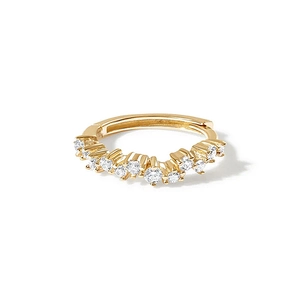 Close-up of gold S925 silver hoop earrings featuring irregular wave-set sparkling zircons