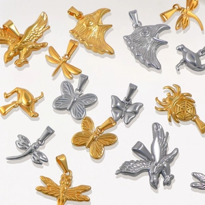 Assorted gold and silver animal charms including eagles and butterflies for DIY jewelry