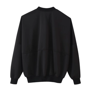Detail view of the ribbed cuffs and back seam on this black crewneck bomber jacket