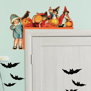 Macro detail of a vintage wooden Halloween door corner decoration featuring a retro witch