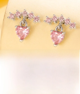 Detail of pink heart zircon pendant earrings with silver titanium steel screw backs
