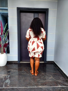 Rear view of a summer two-piece set featuring geometric prints on beige cotton fabric