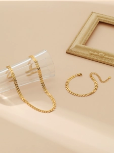 Detail showing 18k gold wheat leaf jewelry set with necklace and adjustable bracelet