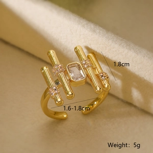 Macro shot of 18K gold plated copper ring featuring rectangular cubic zirconia and side stones