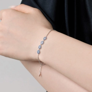 Macro shot of a 925 sterling silver evil eye bracelet with sparkling blue stones