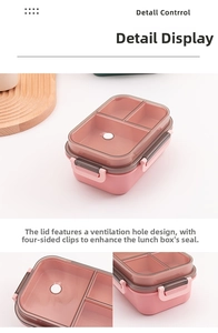 Detail view of pink lunch box lid with a built-in air vent and secure four-side locking latches