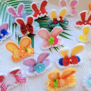 Collection of handmade crochet rabbit ear hair clips in assorted colors and patterns