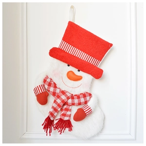 Detail of plush snowman Christmas stocking with red striped hat and checkered scarf