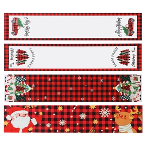 Christmas table runner with red buffalo plaid patterns featuring Santa and reindeer designs