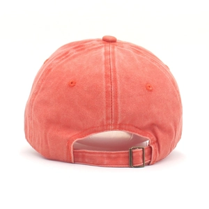 Detail view of washed cotton baseball cap showing adjustable brass buckle and back structure