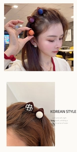 Detailed close-up of velvet cat ear hair clips in various colors with a Korean style design