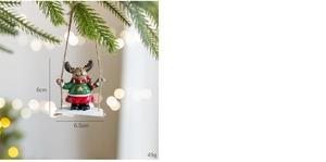 Christmas reindeer on a swing ornament with dimensions 6x6.5cm on a festive tree
