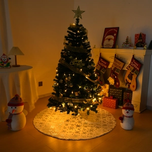 Detailed Christmas tree scene with white plush tree skirt and gold snowflake patterns