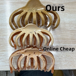 Detailed comparison of brown and cream octopus hair claws on a wood textured surface