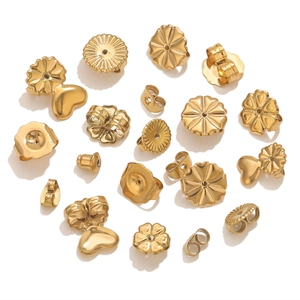 Macro view of assorted gold stainless steel butterfly and flower earring backs for DIY