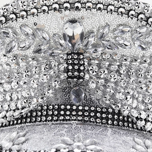Detailed macro view of silver sequins and sparkling rhinestones on a bridal party hat