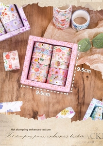 Close-up of floral washi tape set with gold foil accents and 9.5cm square packaging
