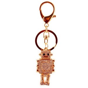 Golden robot keychain with sparkling rhinestones and lobster clasp on white background