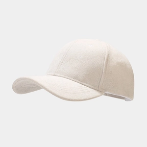 Close-up of beige baseball cap featuring premium soft faux suede texture and seamless stitching