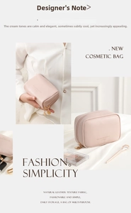 Detail of cream faux leather makeup bag featuring gold zippers and premium texture
