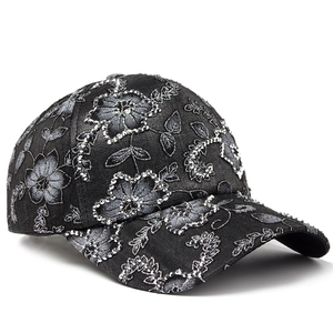 Women's black baseball cap with silver flower embroidery and sparkling rhinestones