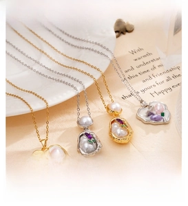 Detail view of baroque pearl necklaces with colorful zircon stones on gold chains