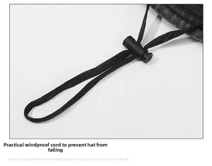 Detail of adjustable windproof rope with plastic toggle on a washed outdoor bucket hat