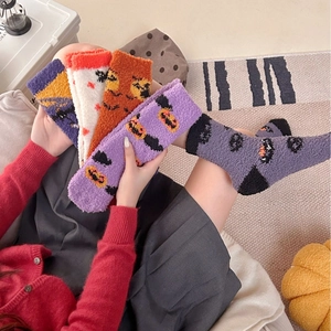 Soft Halloween coral fleece socks for women featuring pumpkin and ghost patterns