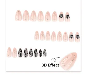 Short almond press-on nails with 3D black floral design and silver metallic lines