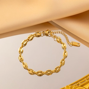Elegant gold pig nose coffee bean chain necklace with adjustable clasp and satin background