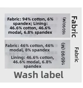 Detail view of the clothing wash care label showing cotton blend fabric and size M