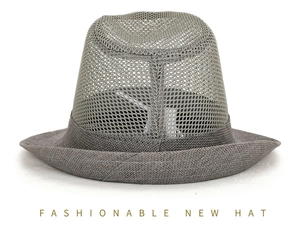 Close-up of grey breathable mesh fabric and woven brim on a summer sun hat