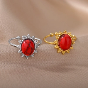 Vintage stainless steel ring with red stone and sunburst pattern in gold and silver