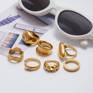 Detail of seven-piece gold plated stainless steel ring set with stars and stones