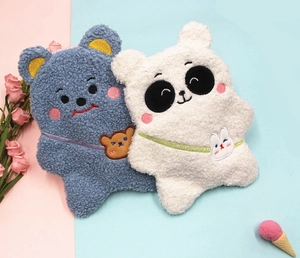 Detail of plush bear and panda stationery bags with soft lamb wool texture and cute embroidery