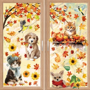 Detailed view of autumn window stickers with colorful leaves, pumpkins, and pets on glass