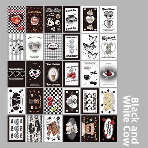 Macro shot of 30 retro black and white card stickers featuring cute motifs and red accents