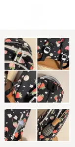 Detail view of strawberry floral backpack with dual zippers and side umbrella pocket