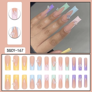 Rainbow French tip press-on nails with 3D bow charms and colorful long coffin design