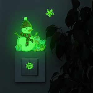 Glow in the dark Christmas snowman and snowflakes sticker showing green fluorescent effect