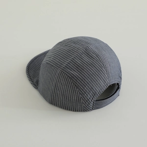 Detail of baby striped 5-panel cap featuring blue twill fabric and adjustable strap back