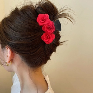 Elegant flocked red rose hair claw clip for women, styled on hair for Valentine's Day look