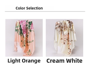 Detail of floral satin silk scarves in light orange and cream white with glossy finish