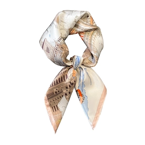 French retro style silk scarf with map pattern tied in a bow on white background